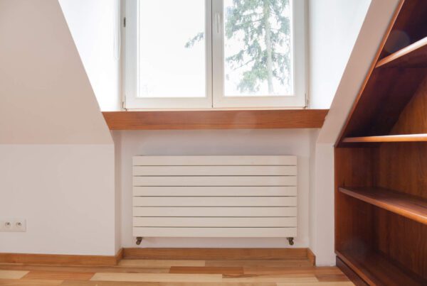 Radiator in cozy room with wooden elements